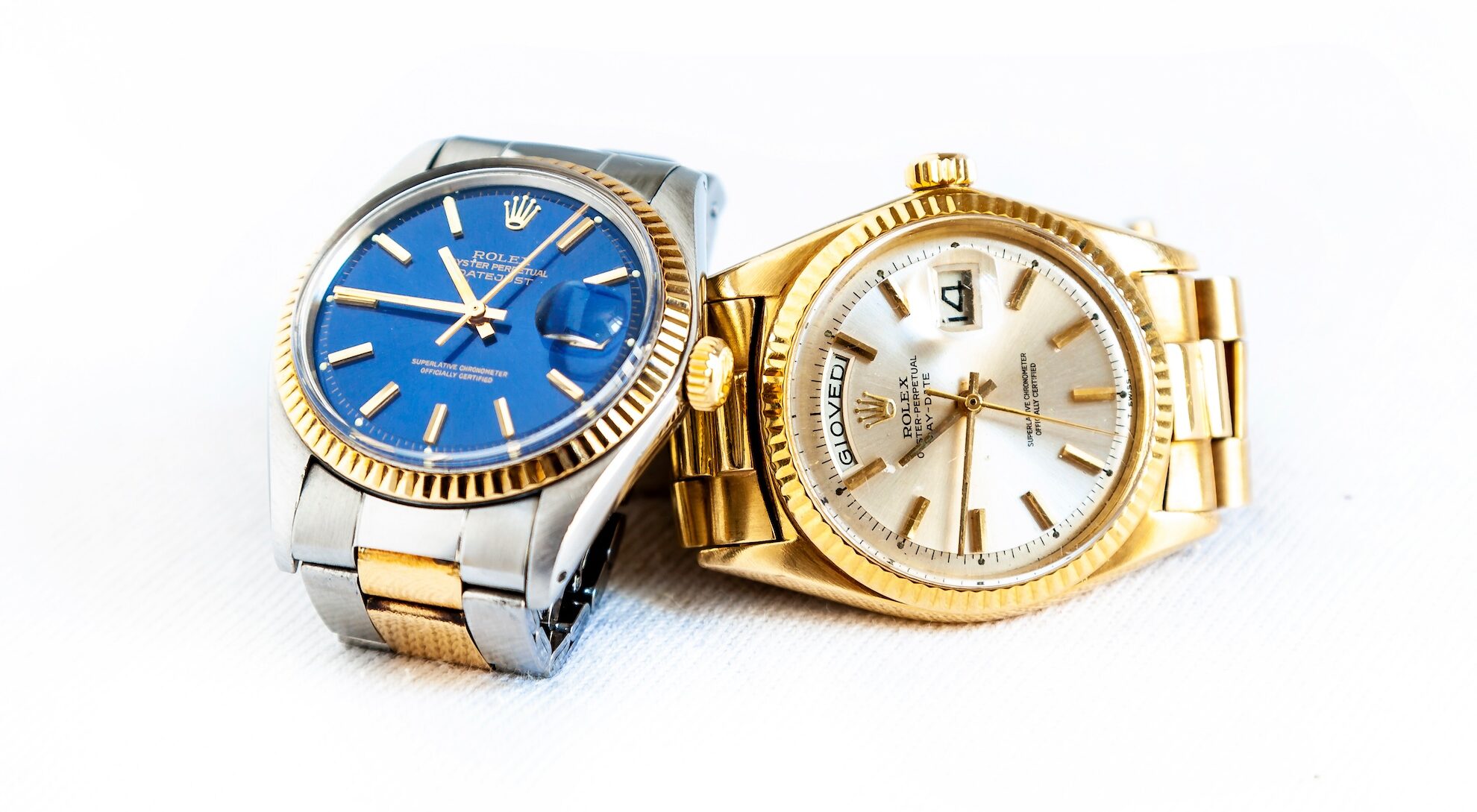 Rolex Oyster Perpetual Day- Date and Oyster Blue watch on white background Rolex Watches